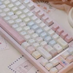 Dreamy pink star keycaps, showcasing their delicate starry celestial patterns for a personalized keyboard aesthetic.