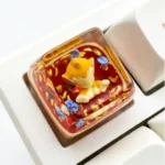 Vibrant handcrafted Chimchar Pokemon artisan keycap, made from translucent resin, showcasing playful anime art for mechanical keyboards.