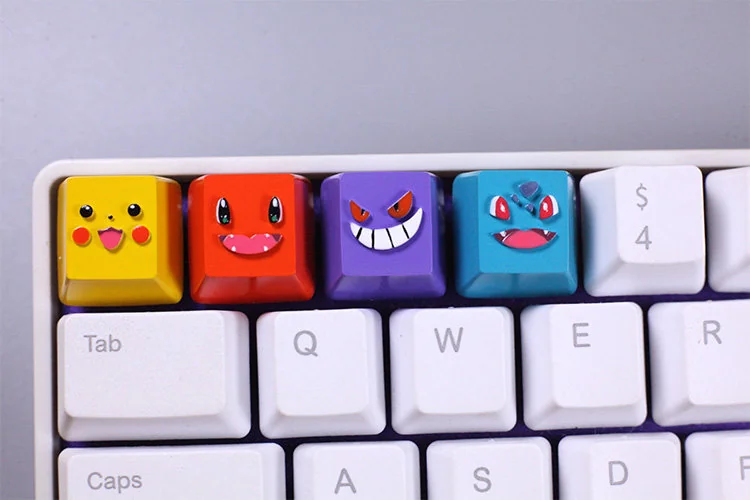 Artistic collection of handcrafted resin Bulbasaur and Charmander Pokemon keycaps from various angles, emphasizing their vibrant details and unique art design.