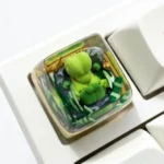 Vibrant, handcrafted SA profile Treecko Pokemon keycap made of translucent resin, perfect for artisan RGB mechanical keyboards.