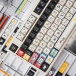 A collection of Pokemon PBT keycaps set from various angles, showcasing the modern geometric art and stunning backlit refraction for artistic touch.