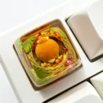 Vibrant handcrafted Pokemon Torchic artisan keycap, made from translucent resin with a classic SA profile, showcasing its backlit detail.