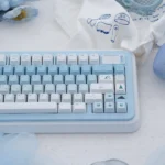 Detailed side view of the durable Arctic Bear gradient blue PBT dye-sub keycap set, showcasing its serene blue-white fade and artistic polar bear.