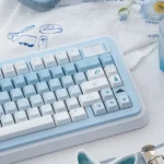 Arctic Bear Gradient Blue PBT Dye-Sub Keycap Set, presented from various angles, highlighting its serene blue and white arctic ice gradient.