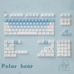 Artistic collection of Arctic Bear Gradient Blue PBT Dye-Sub Keycap Set, showcasing durable PBT keycaps from various angles with serene blue and white.