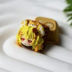 Whimsical handmade resin mouse keycap showcasing its adorable biscuit design from multiple angles. Perfect for ESC keys.