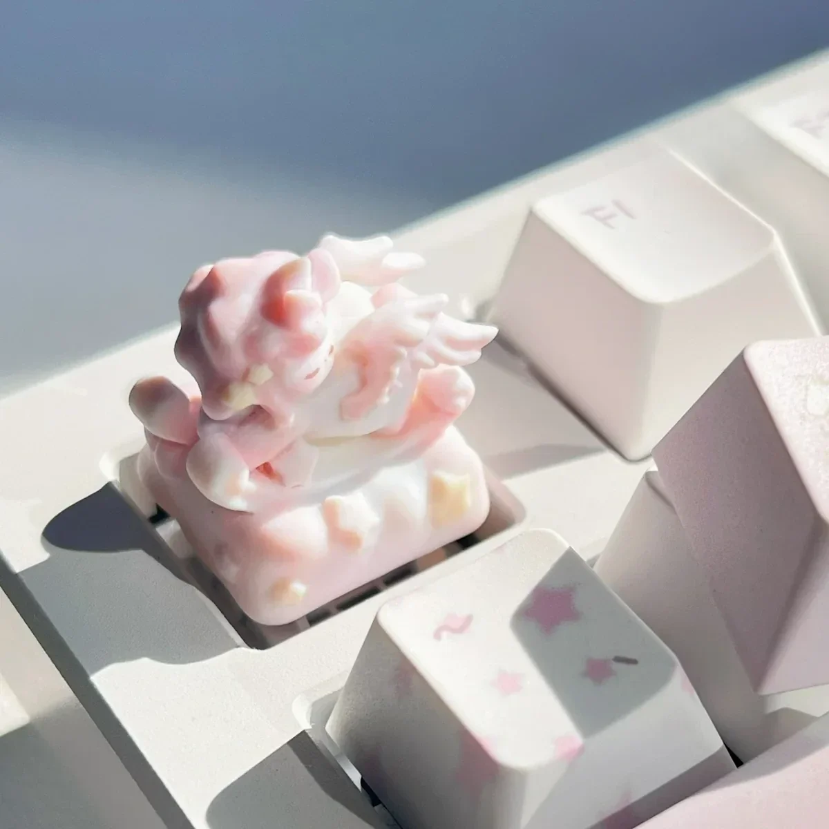 A detailed view of the Whimsical Rocking Horse Angel Baby Artisan Keycap, highlighting its serene, dreamlike design and intricate craftsmanship.