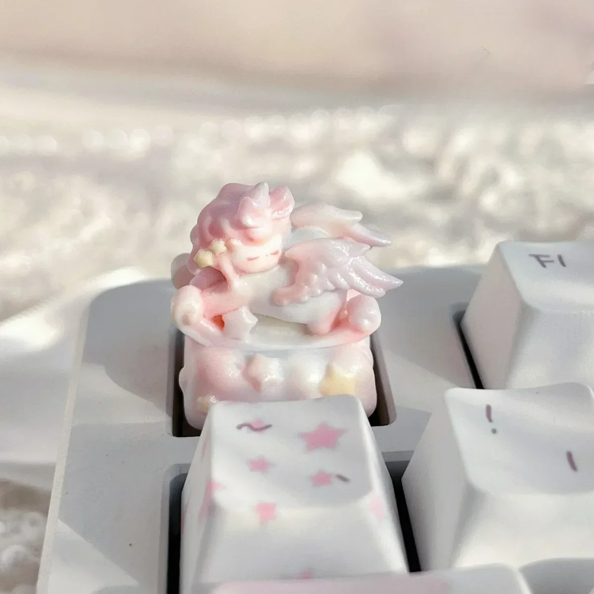 Whimsical Rocking Horse Angel Baby Artisan Keycap, featuring a serene angelic figure on a dreamlike rocking horse, evoking nostalgic childhood memories.