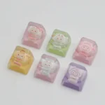 Adorable handcrafted Sanrio pajama ESC keycap, viewed from a new angle, featuring cozy characters in vibrant resin art, a charming custom keyboard accent.