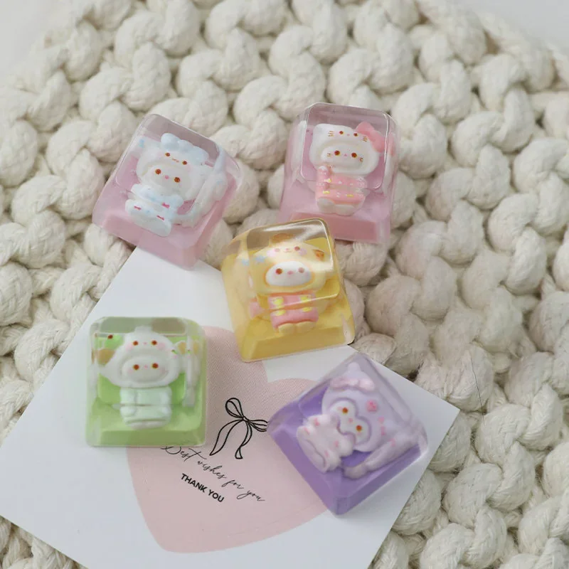 Adorable handcrafted Sanrio keycap featuring beloved characters in cozy pajamas, made from vibrant resin, perfect as a charming ESC keycap desk accent.