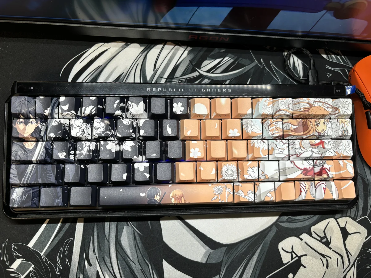 Playful SAO Kirito & Asuna PBT side-lit shine-through keycap set, showcasing iconic Sword Art Online characters and vibrant side-printed legends.