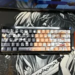 Playful SAO Kirito & Asuna PBT side-lit shine-through keycap set featuring iconic Sword Art Online characters and vibrant legends.