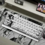 A collection of Shinobu Kocho Demon Slayer PBT dye-sub keycaps set, showcasing vibrant teal butterfly designs from various artistic angles.