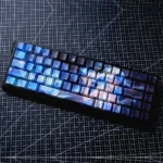 Exclusive Wuthering Waves Shorekeeper PBT Dye-Sub keycaps set, showcasing intricate mystical guardian designs, rugged textures, and ocean-inspired colors.