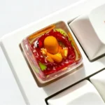 Vibrant, handcrafted Luminous Charmander Pokemon keycap (SA profile) glowing brightly, a collectible piece for enthusiasts.