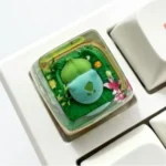 Vibrant handcrafted Bulbasaur SA profile Pokémon artisan keycap, showcasing intricate detail in translucent resin.