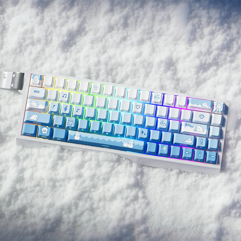 A close-up view of the unique Snowflake Seal PBT Dye-Sub Keycaps Set, showcasing their charming blue gradient and whimsical snowflake motifs from various angle.