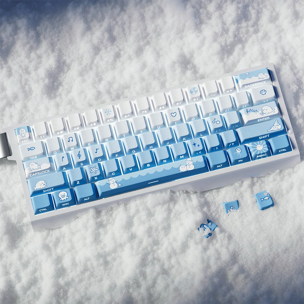 Close-up of unique Snowflake Seal PBT Dye-Sub keycaps set, showcasing the artistic blue gradient and whimsical snowflake motifs from a distinct angle.