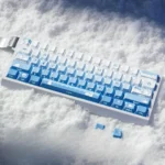 Unique Snowflake Seal PBT Dye-Sub Keycaps set, showcasing a charming blue gradient and whimsical snowflake motifs for an artistic keyboard upgrade.