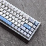 Sora Kasugano PBT Dye-Sub Keycaps Set, viewed from various angles, highlighting iconic anime artwork, white and black Waifu Edition design.