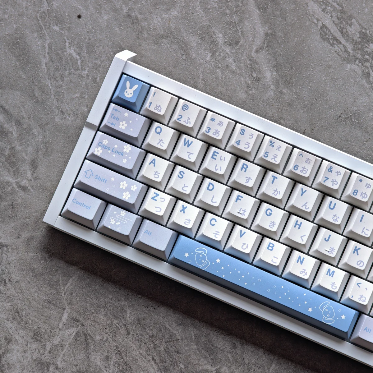 Sora Kasugano PBT Dye-Sub Keycap Set shown from multiple angles, featuring exclusive waifu artwork and a playful white/black anime design.