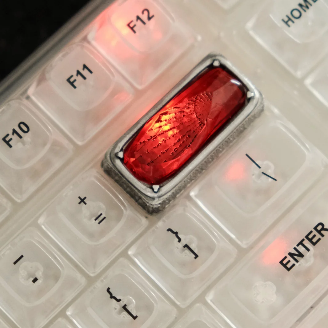 Luminous Sorcerer's Stone Keycap, an artisan backspace. Multiple angles reveal its mystical glow, wizarding artifact, and stone enchantment.