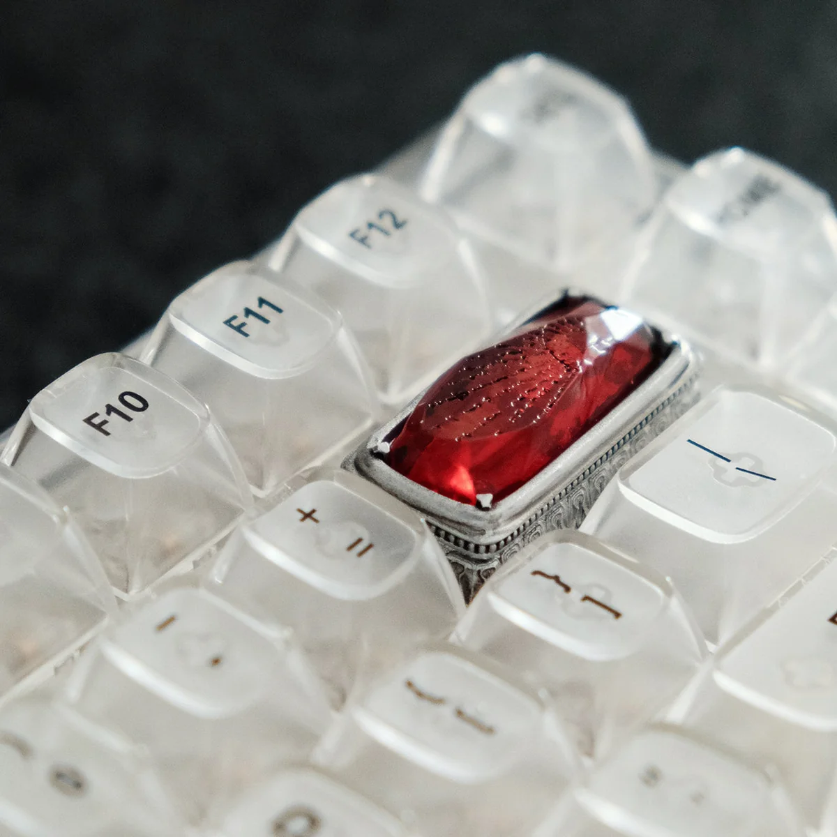 Luminous Sorcerer's Stone artisan keycap. See its mystical glow from various angles. A captivating Wizarding World backspace.