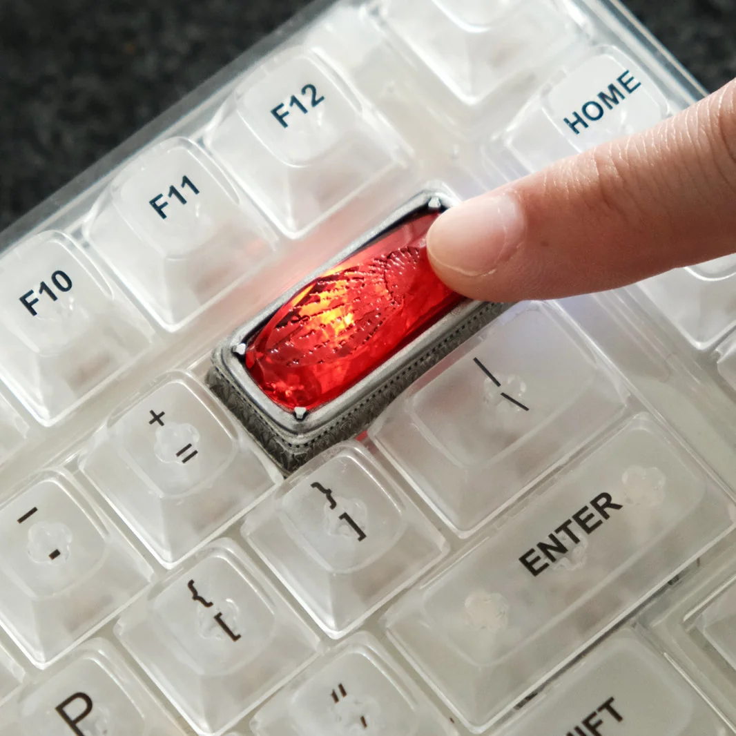 Enchanting Luminous Sorcerer's Stone artisan keycap, glowing with mystical power, a unique Wizarding World backspace for your keyboard.
