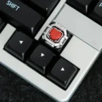 Artisan-crafted Whimsical Space Capsule Resin Keycap. Unique miniature space capsule with a playful bear and heart. Premium handcrafted detail visible design.