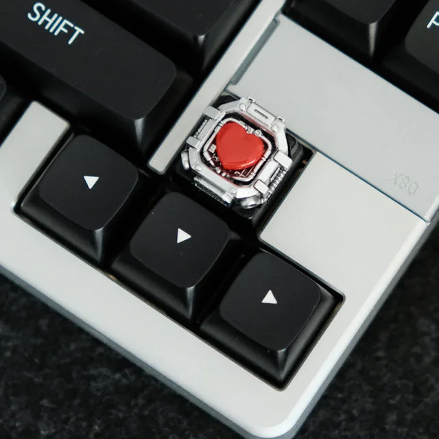 Artisan-crafted Whimsical Space Capsule Resin Keycap. Unique miniature space capsule with a playful bear and heart. Premium handcrafted detail visible design.