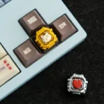 Artisan-crafted whimsical space capsule resin keycap, showcasing its intricate miniature bear astronaut and tiny heart detail from a unique angle.