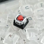 Whimsical handcrafted resin space capsule keycap, detailed from a new angle, revealing its intricate miniature bear and heart design, emphasizing unique setup.