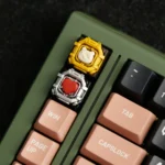 Close-up of a whimsical handcrafted resin space capsule keycap, showcasing its intricate miniature design with a charming bear and heart inside.