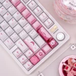 Artistic view of the Spring Bloom Keycap Set, highlighting soft hues, delicate spring blossoms, and its luminous pearlescent shines.