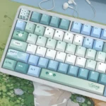 An artistic view of the Elegant Spring Notes PBT Dye-sublimation Keycaps Set, featuring delicate blossoms and soft hues, capturing serene natural beauty.