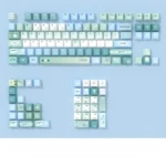 Elegant Spring Notes PBT Dye-sublimation Keycaps set, artfully displayed from various angles, highlighting delicate spring blossoms and poetic motifs.