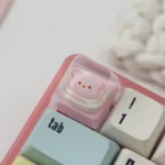 Close-up of the Strawberry Bear Pie Transparent Keycap, showcasing its vibrant colors and charming dessert-inspired design with a playful setup.