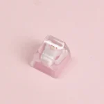 Close-up of a whimsical Strawberry Bear Pizza Artisan Keycap, showcasing its handcrafted resin, vibrant colors, and glossy finish from various playful.