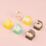 A close-up view of a handcrafted miniature dessert keycap, showcasing its whimsical details and irresistible charm as a sweet keyboard ESC accessory.