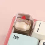 Whimsical handcrafted dessert keycap, a miniature realistic sweet sculpture, with charming artistic details for an irresistible keyboard ESC charm.