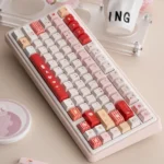 Playful Strawberry Delight PBT Dye-Sub Keycaps set, showcasing durable pastel pinks, reds, and creams with a sweet strawberry dessert motif.