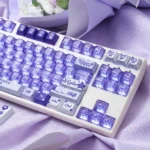 Vibrant summer flower keycaps set, showcasing the shine-through PBT+PC material from a unique, artistic angle, evoking a serene design.