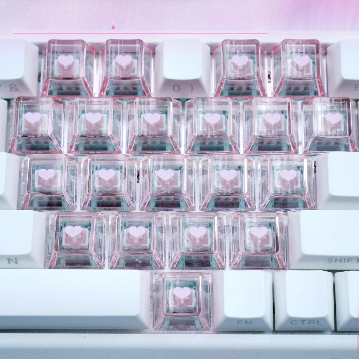 A close-up view of the Sweetheart Sparkle Heart Supplement Keycap Set, showing charming translucent heart keycaps with a delightful sparkling finish from various angle.