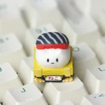 Detailed view of a vibrant handcrafted sushi cat artisan ESC keycap, highlighting its intricate resin design and whimsical character. A unique keyboard.