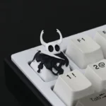 Exquisite handcrafted Hollow Knight The Knight resin keycap from multiple angles, showcasing its intricate dark fantasy design and artisan quality.