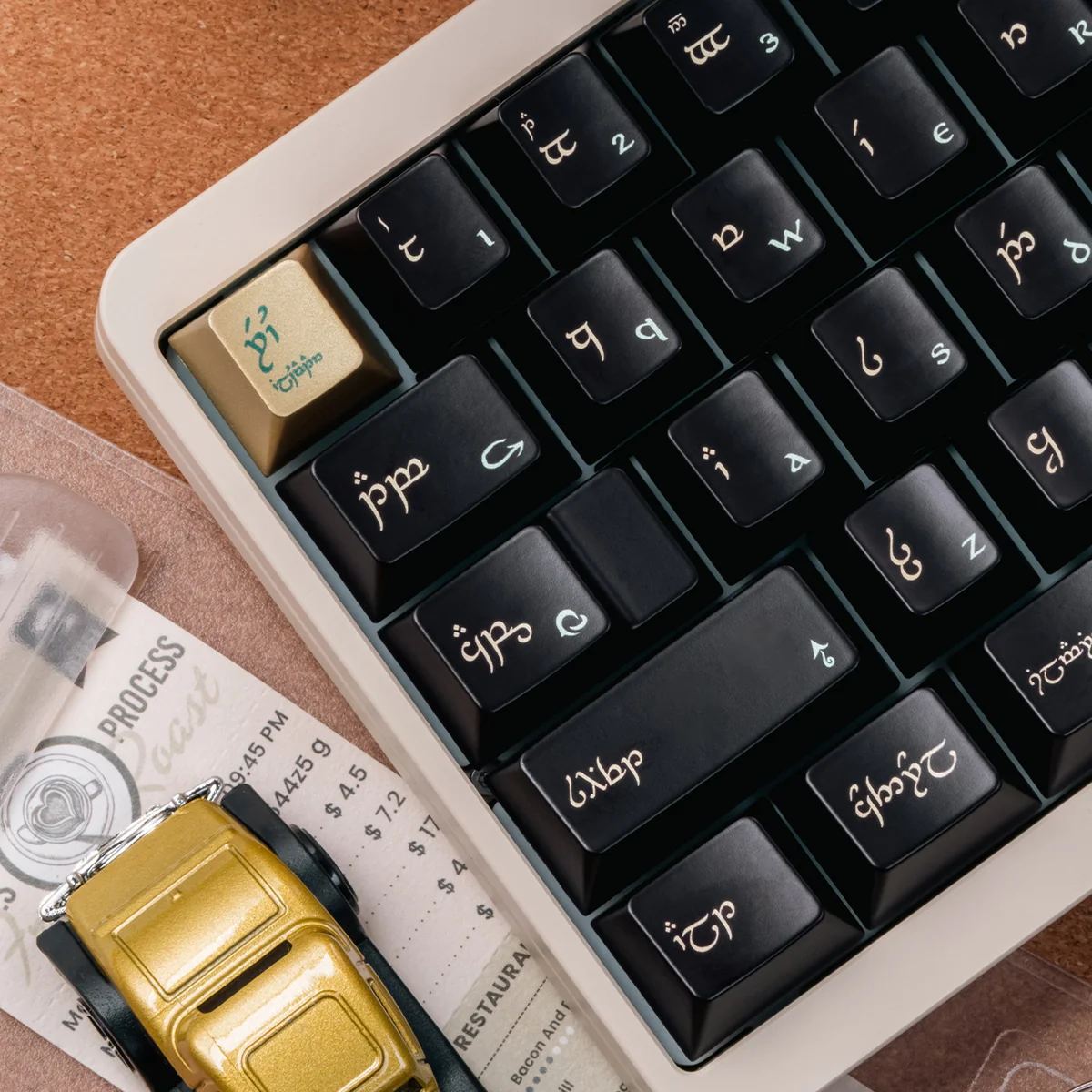 Black-gold PBT keycaps set, multiple angles highlighting their unique luxurious finish. Dark, mythical elegance and premium metallic sheen.