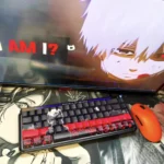 Exclusive Tokyo Ghoul Ken Kaneki PBT keycaps set from a distinct angle, highlighting their dark, mysterious side-lit legends and anime aesthetic.