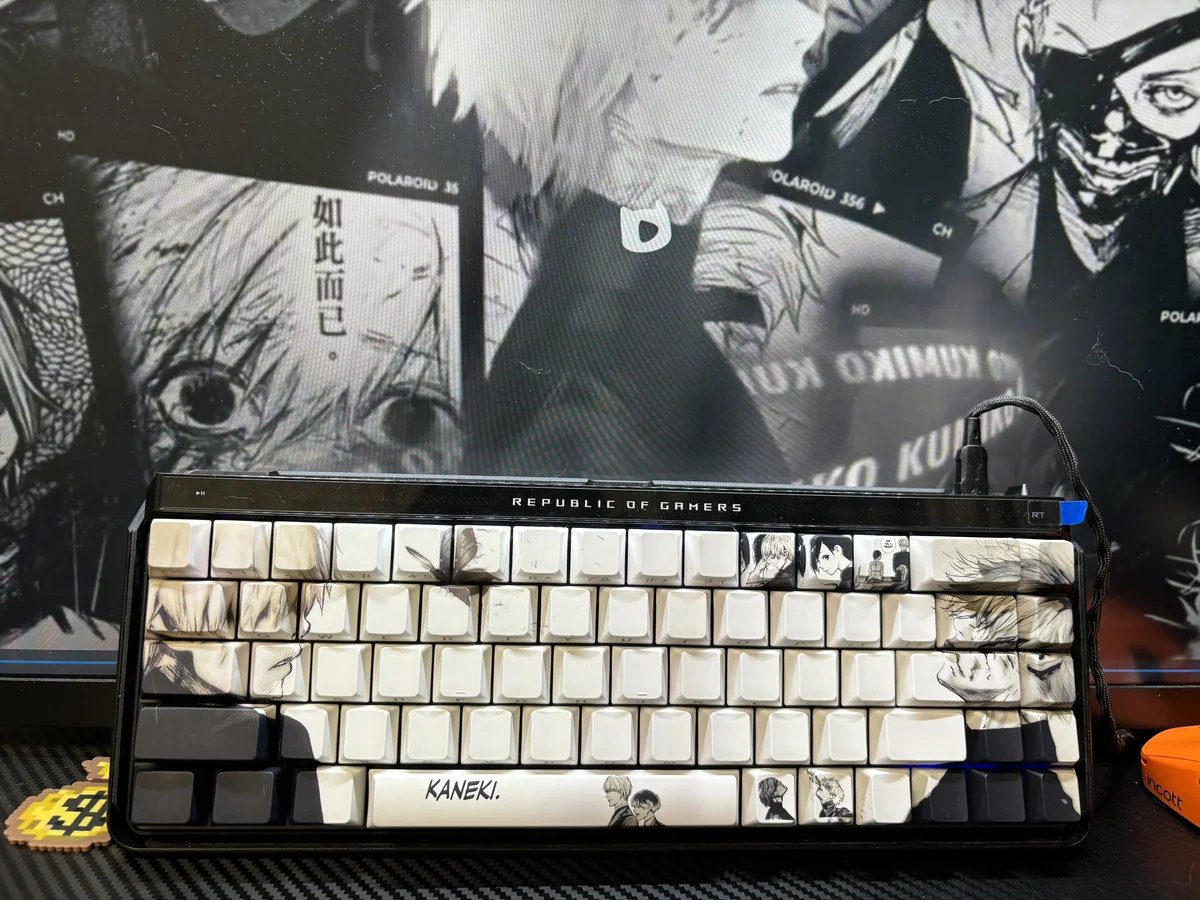 Artistic close-up of Tokyo Ghoul side-printed shine-through PBT keycaps set, showcasing dark anime aesthetic and illuminated legends from various angles.