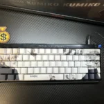 Dark, anime-inspired Tokyo Ghoul PBT keycaps set featuring unique side-printed, shine-through legends. Elevate your keyboard with this artistic design.
