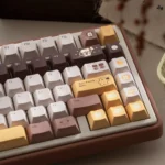 A playful gallery of the Butter Bear tri-mode mechanical keyboard, showcasing its charming design and vibrant RGB backlighting design.